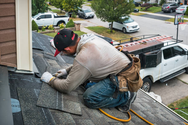 Professional Roofing technician working in East Otis, MA